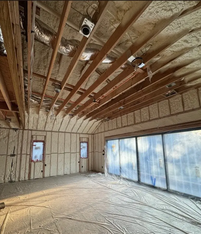 Interior walls and ceiling insulated with spray foam during new construction in Heathrow